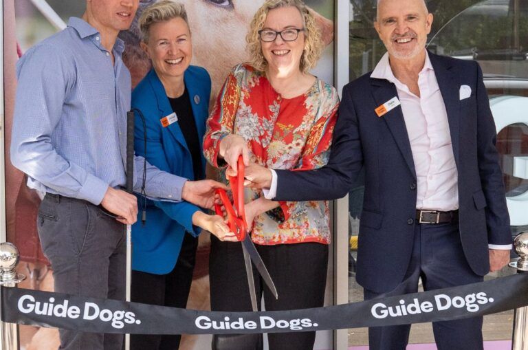 Guide Dogs team cutting the ribbon to the office.