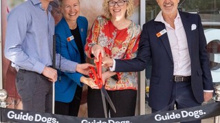 Guide Dogs team cutting the ribbon to the office.