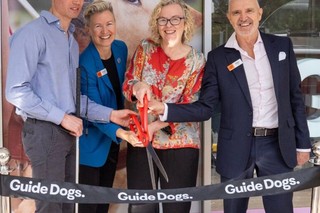 Guide Dogs team cutting the ribbon to the office.