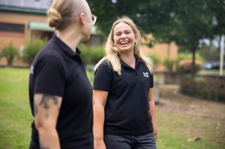 A Guide Dogs Staff member smiling.