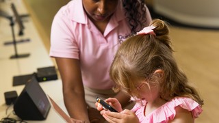 Assistive Technology Specialist Abby with a Client.