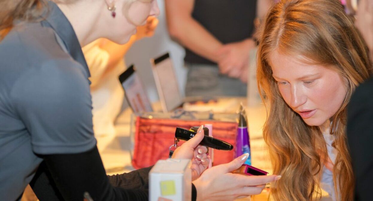 An occupational Therapist demonstrating products.