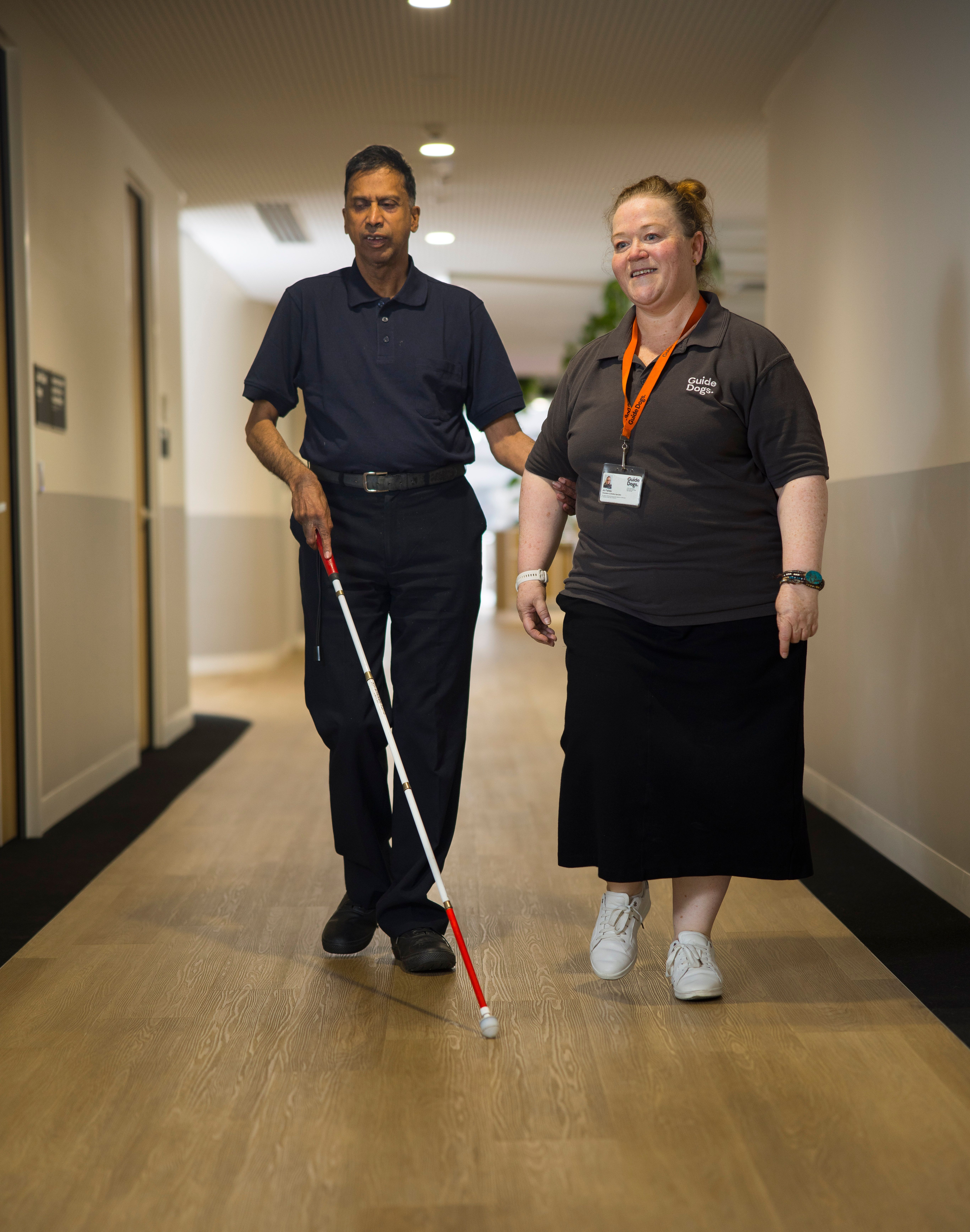 A Client and Staff member walking. 
