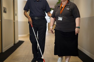 A Client and Staff member walking.