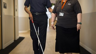 A Client and Staff member walking.