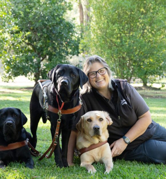A Guide Dog Trainer with Labradors.