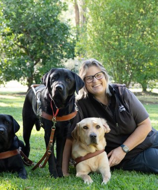 A Guide Dog Trainer with Labradors.