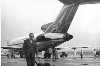 A Handler and his Guide Dog on the Tarmac.
