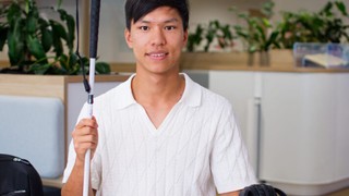Seth sitting at his desk.