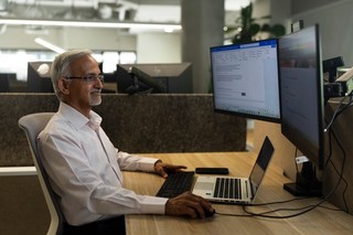 Finance Volunteer at his computer.