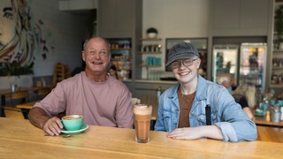 Clients sitting at a cafe together.