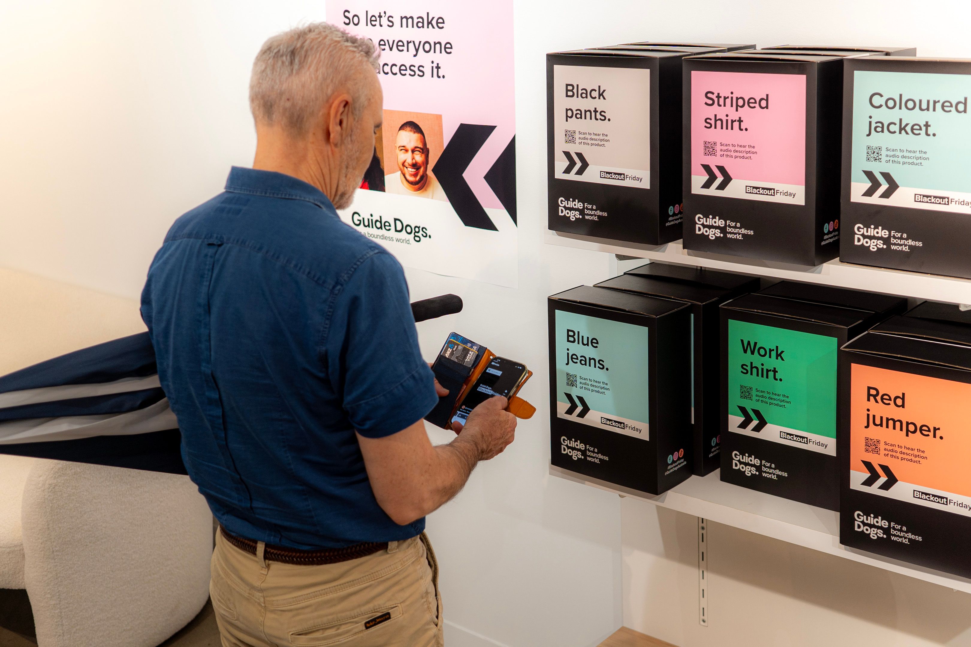 A person looking at boxes at Blackout Friday.