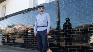 Brian standing with his Guide Dog Quanti.