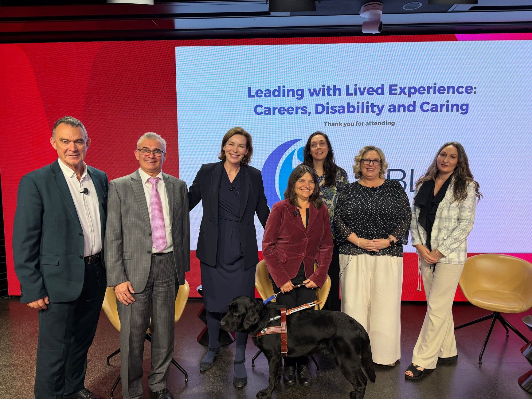 Group photo of Westpac staff with Andy and her Guide Dog.
