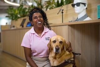 Abby smiling with her Guide Dog Duke.
