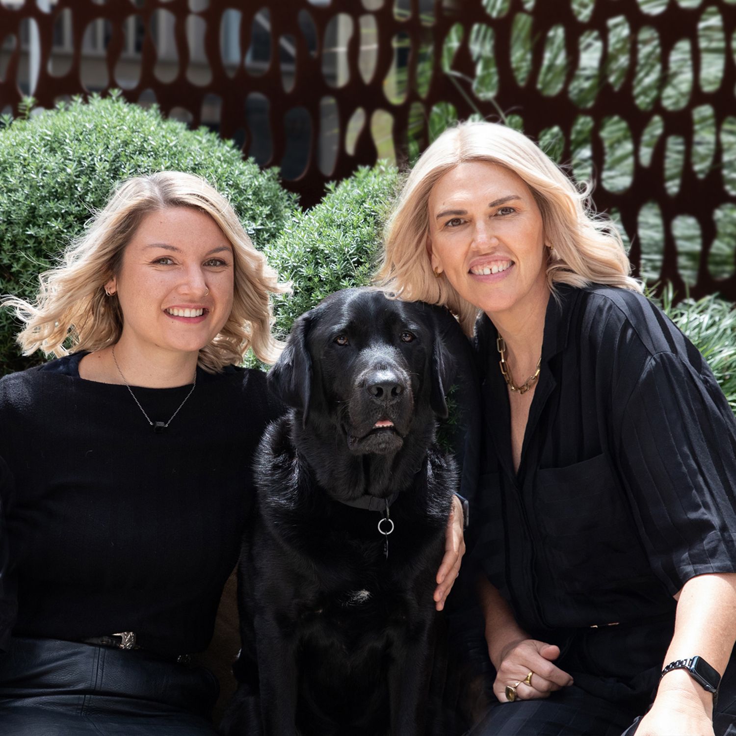 Kristie sitting next to Ambassador Dog Fella