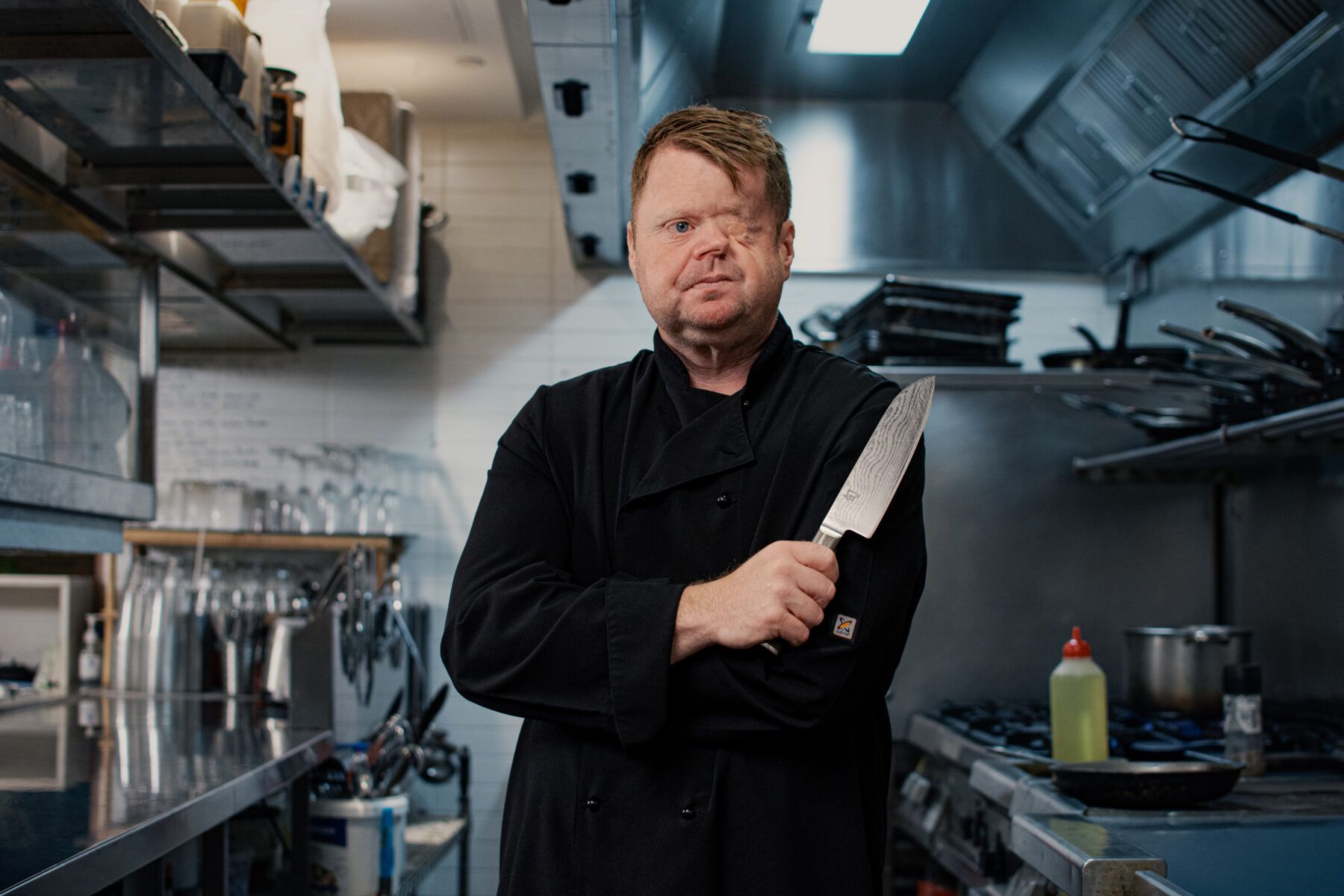 Craig standing in a kitchen.