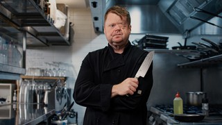 Craig standing in a kitchen.