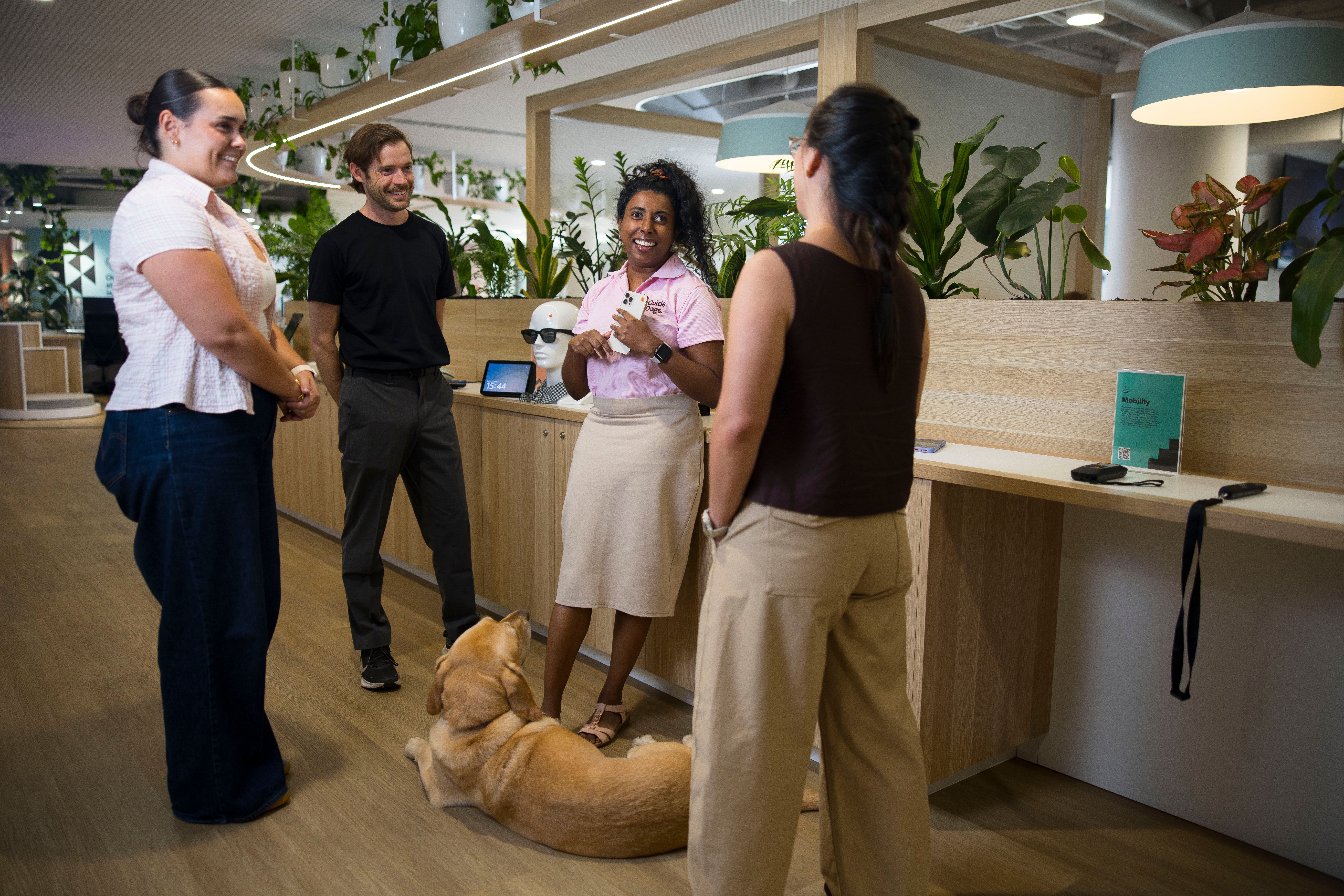 Abby with a group of people at the AT Help Desk. 
