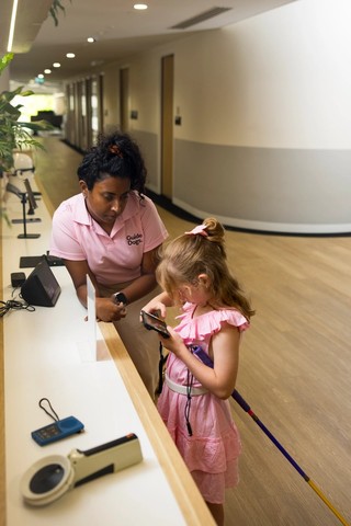 Abby showing assistive technology.