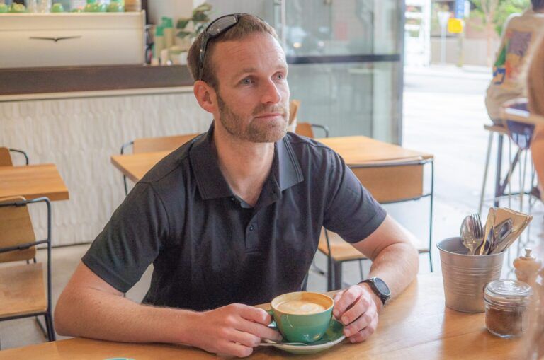A person sitting at a cafe.