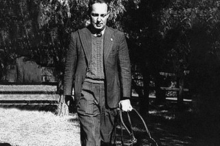 Arnold Cook standing with Guide Dog Dreana.