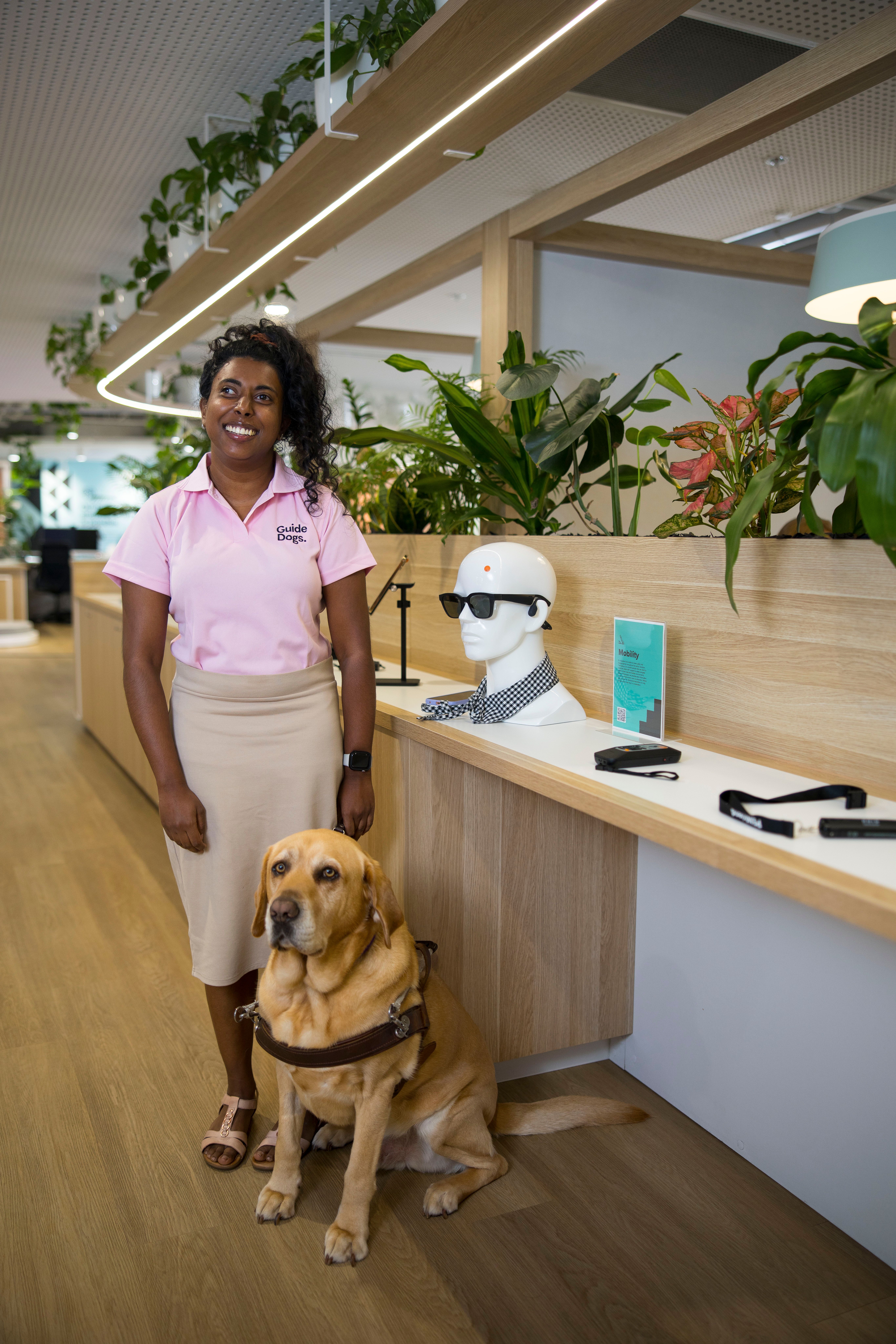 Abby standing with her Guide Dog Duke.