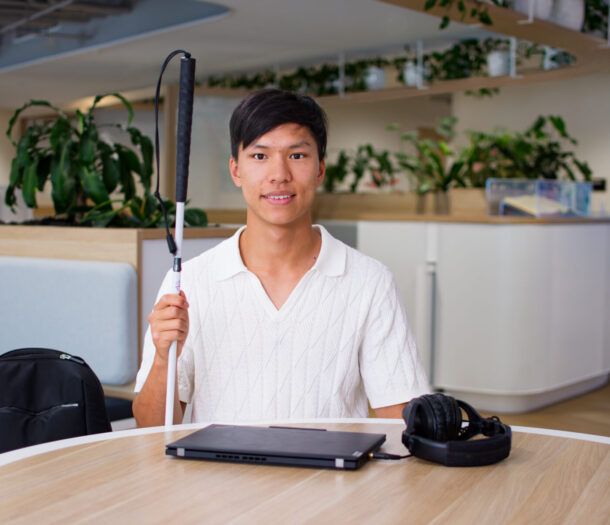Seth sitting at a desk with his computer.