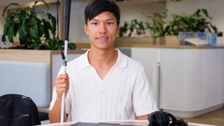 Seth sitting at a desk with his computer.