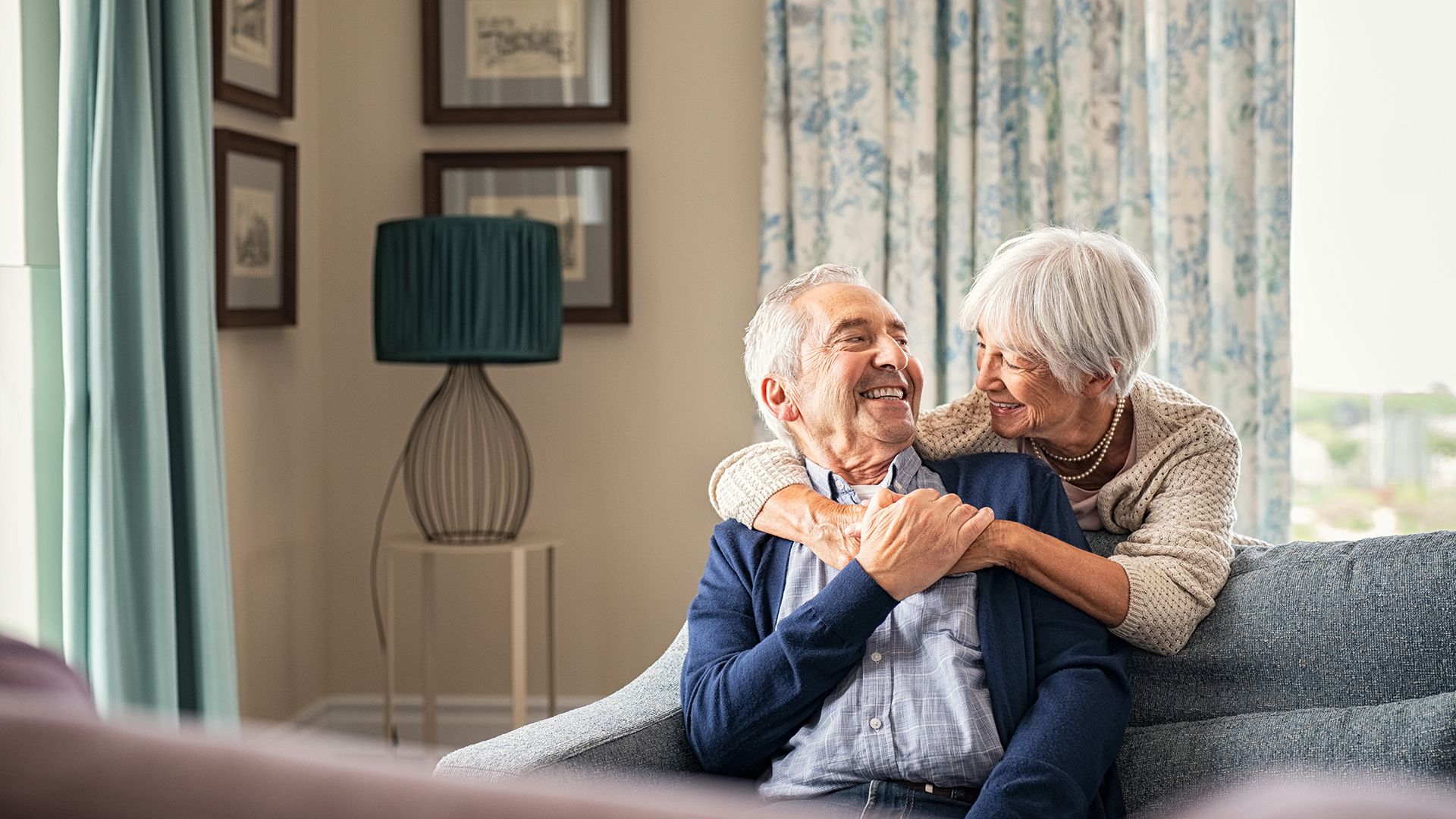 Two people smiling at each other.