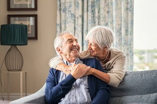 Two people smiling at each other.