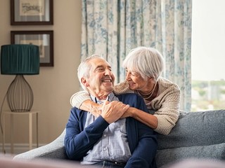 Two people smiling at each other.