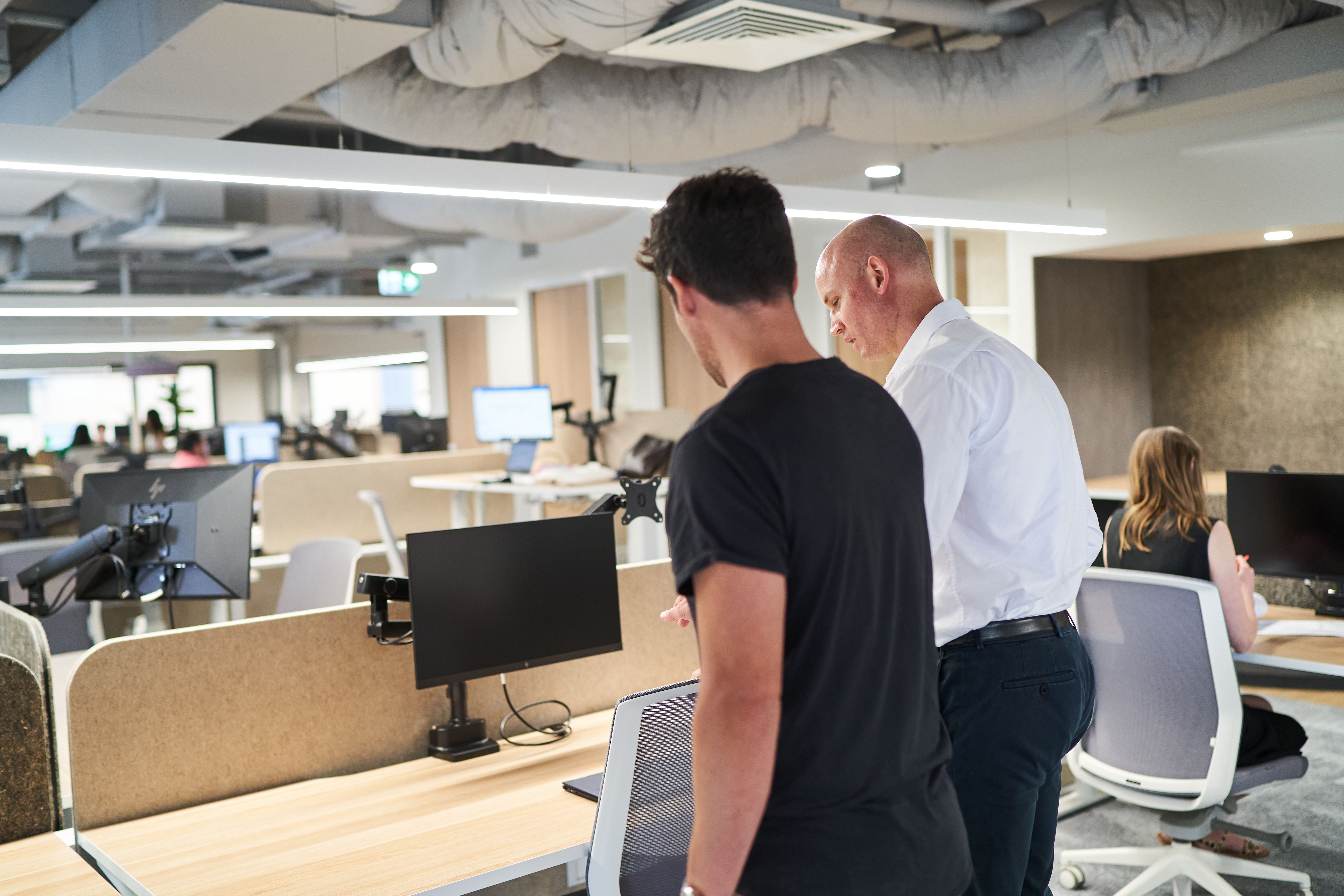 Ben Moxey and Ryan Jones setting up a computer.