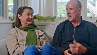 Two people sitting on a couch