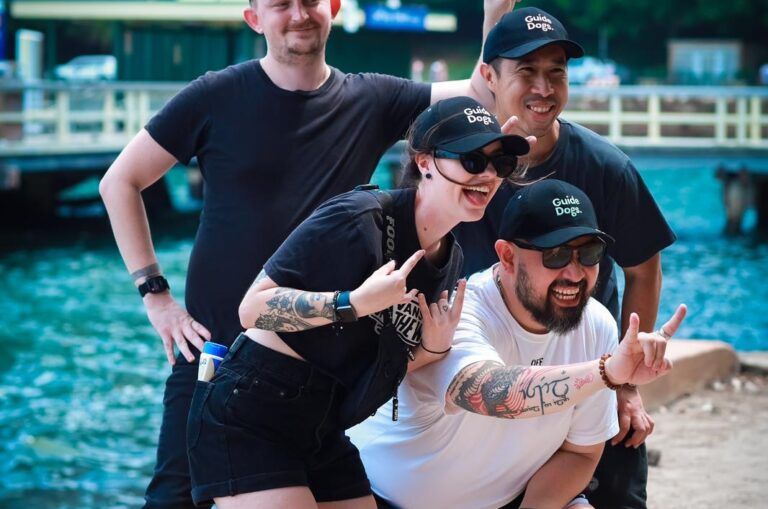 People smiling at the camera.