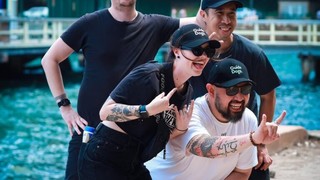 People smiling at the camera.