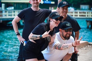 People smiling at the camera.