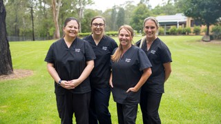 A group of staff members standing together.
