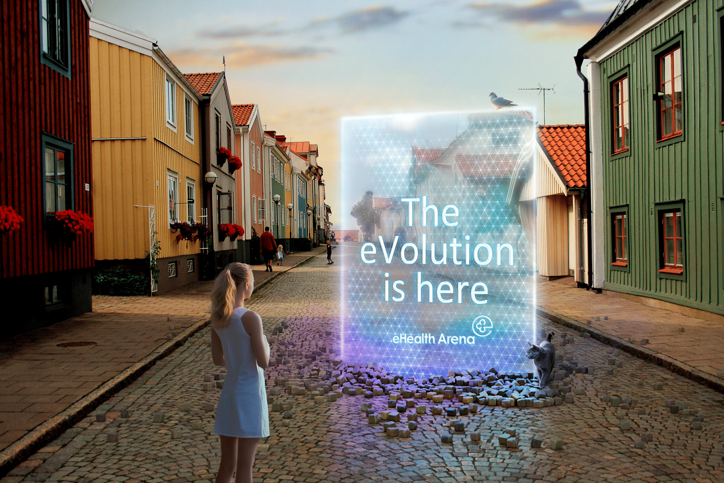 Skylt med texten "The eVolution is here" som har dimpt ner i en kullerstensgata i Gamleby