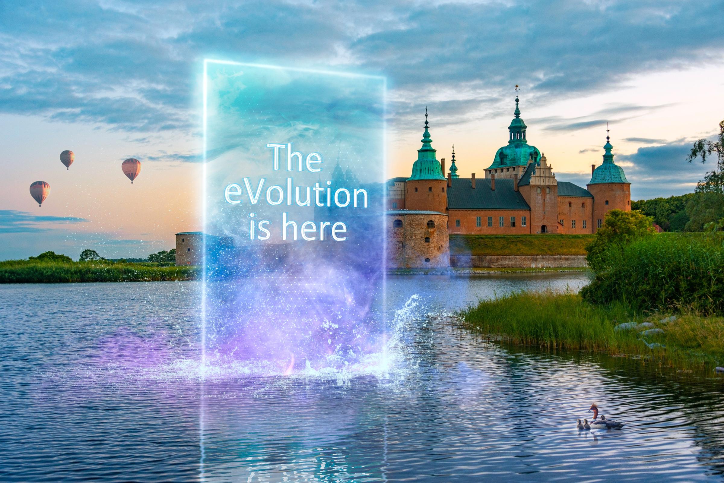 a screen with the tagline "the eVolution is here" on it, in front of Kalmar Castle