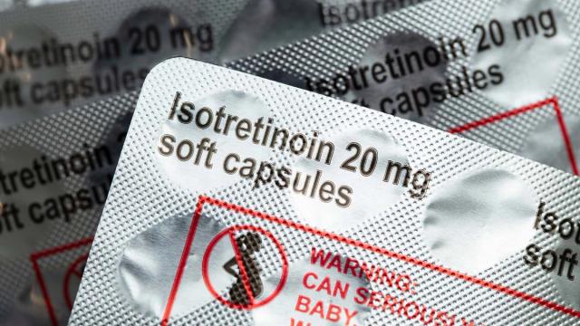 Blister packs of Isotretinoin 20 mg soft capsules with a pregnancy warning symbol.