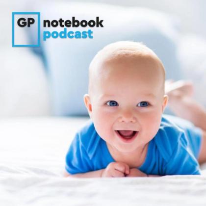 Smiling baby in blue shirt lying on stomach on a bed with the 'GP notebook podcast' logo at the top left corner