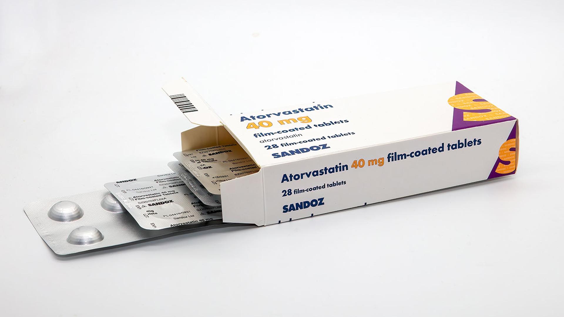 Open box of Atorvastatin 40 mg Sandoz tablets with blister packs.
