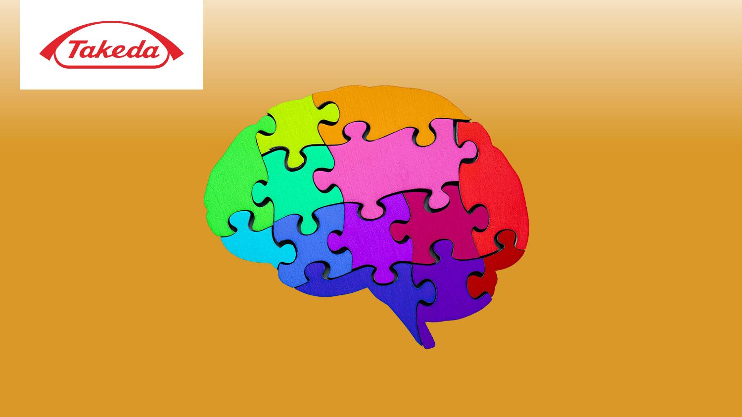 A human brain made of colorful puzzle pieces, with the Takeda logo in the top left corner.