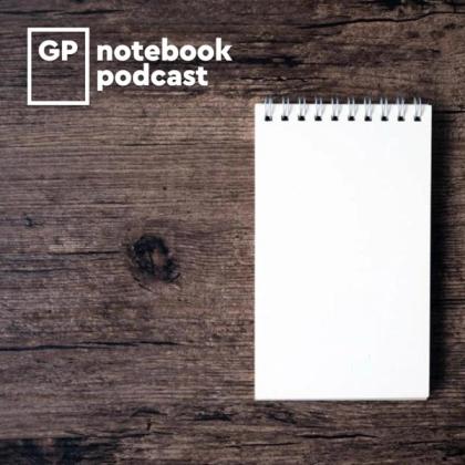 Blank spiral notebook with the logo 'GP notebook podcast' on a rustic wooden background.