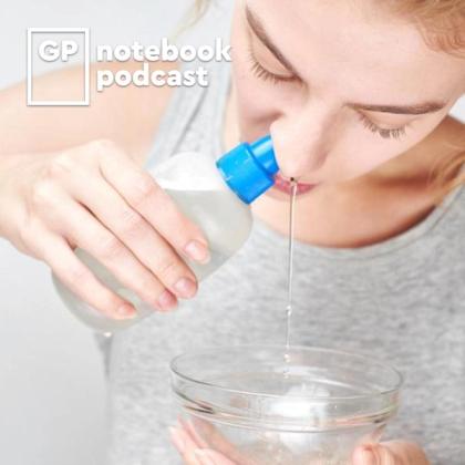 Young woman pouring water from a bottle into a bowl using a small funnel