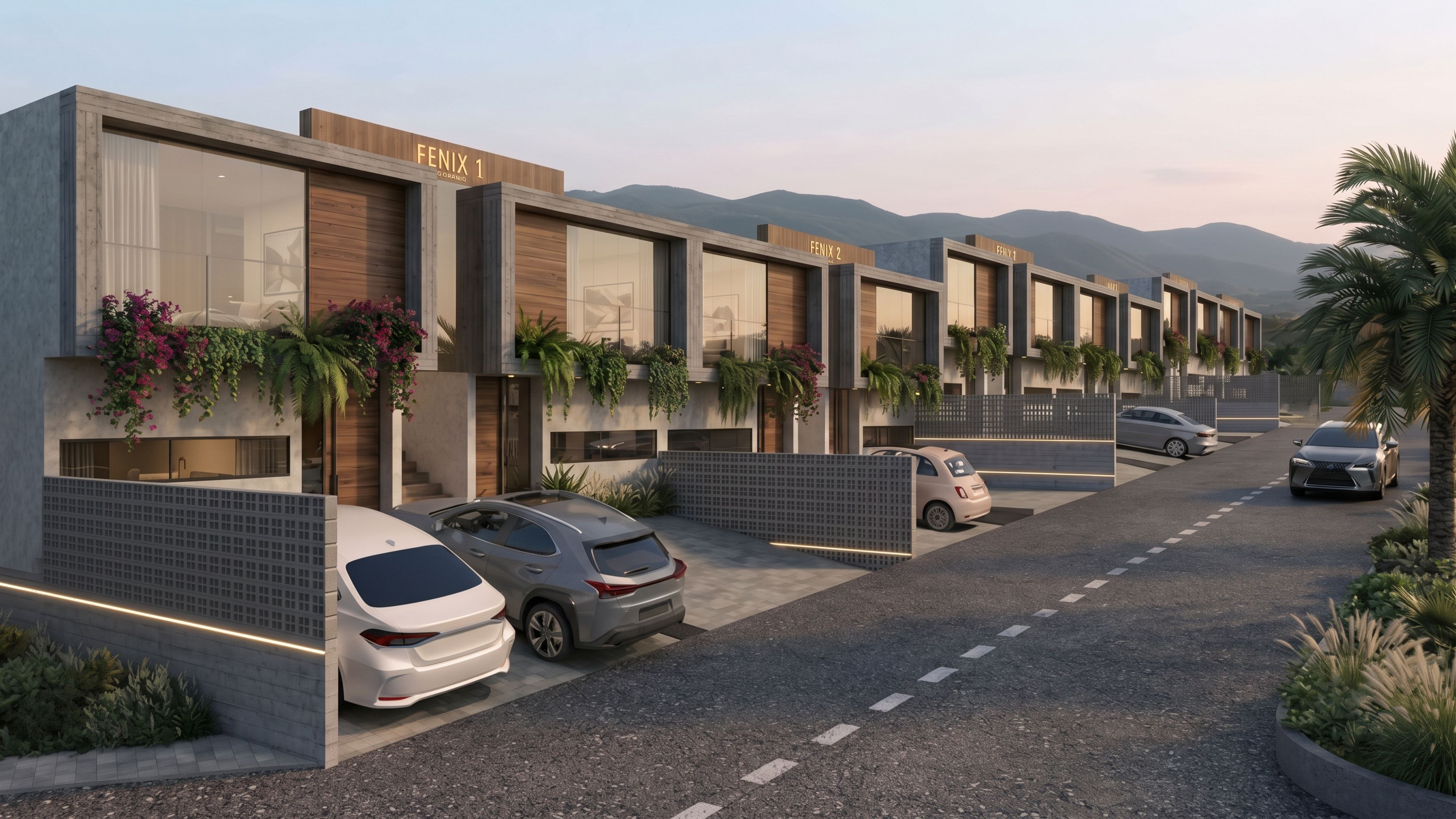 Calle interna del conjunto al atardecer, con los módulos y las montañas al fondo