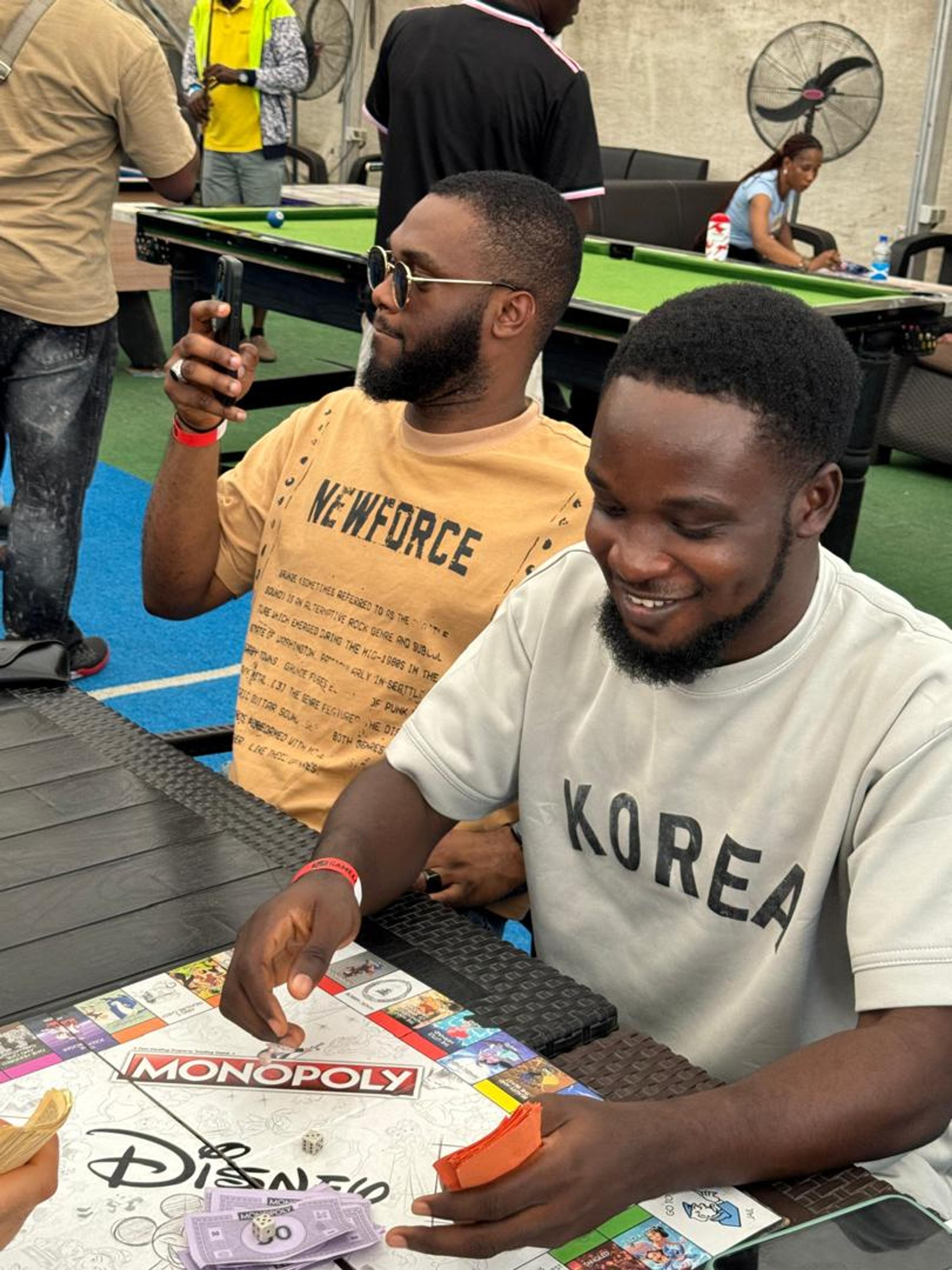 Team members enjoying a game of Monopoly