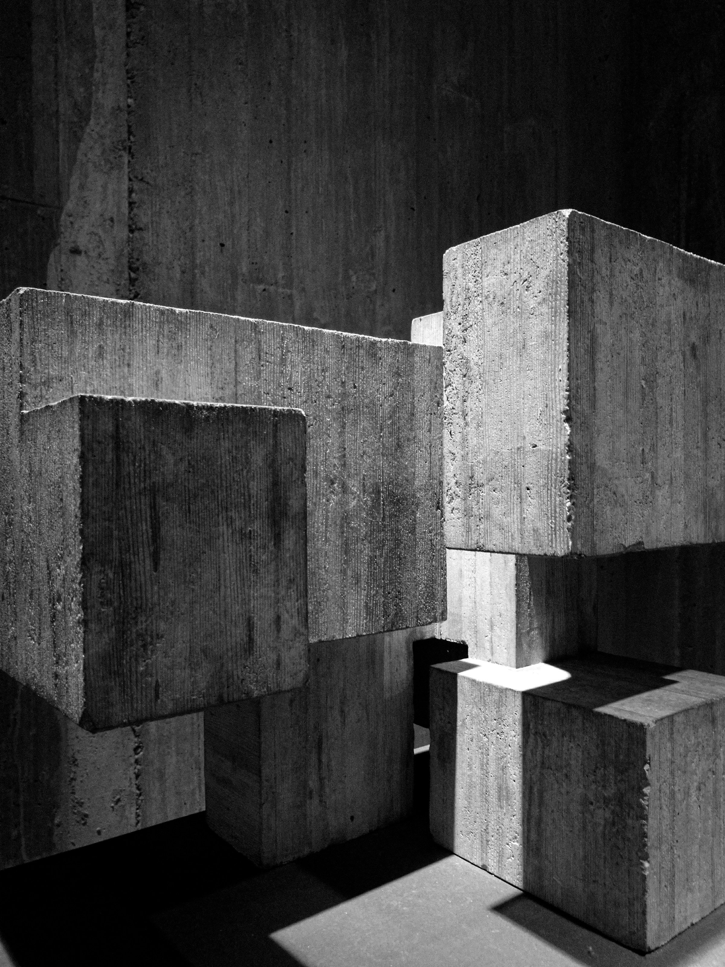 Greyscale photography of concrete blocks