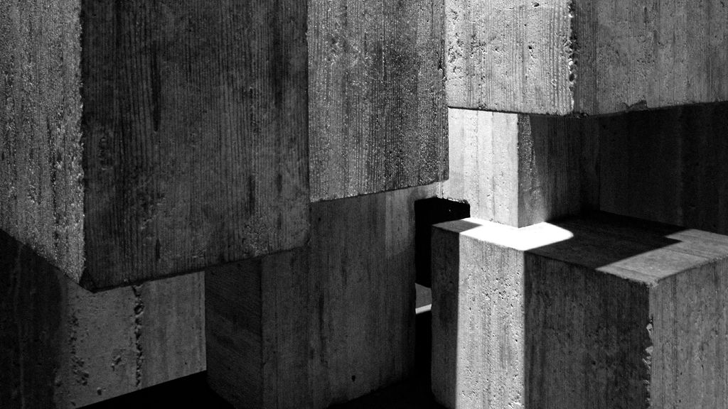 Greyscale photography of concrete blocks